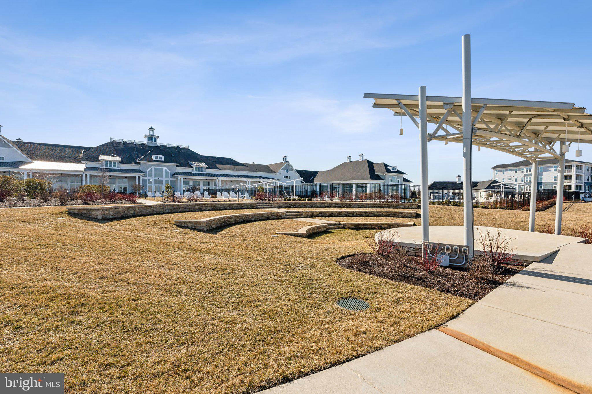 111 Marshgrass Way, Unit 22 Chester, MD 21619 - Photo 66 of 102 a view of a swimming pool with a lake view