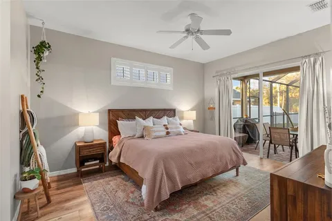 a bathroom with a bathtub a mirror a vanity and a shower