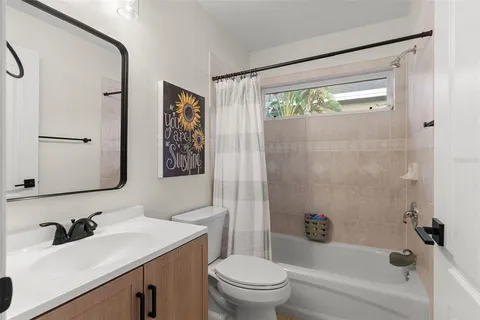 a bedroom with a bed and a desk