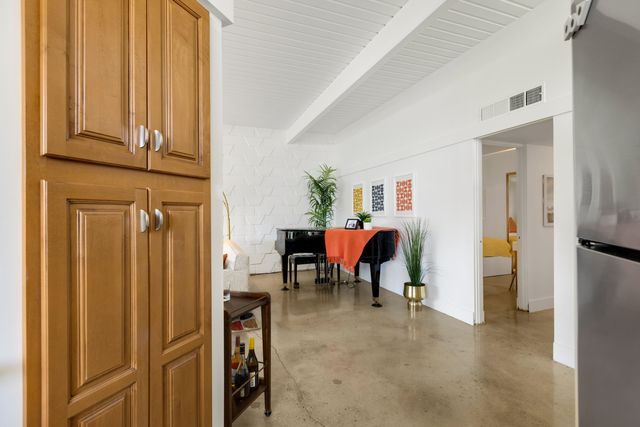 a view of a dining area with furniture window and front door
