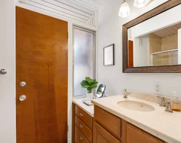 a bathroom with a sink and a mirror