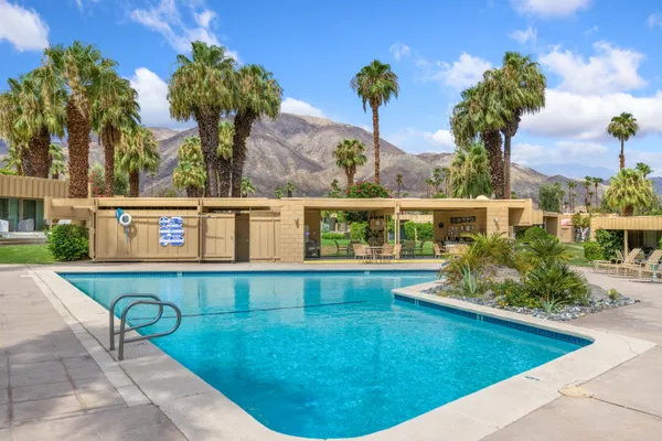 a view of a swimming pool with a patio