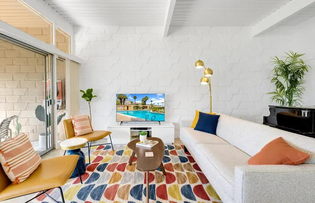 a living room with furniture and a rug