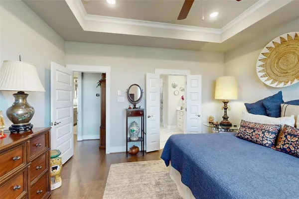 a bathroom with a granite countertop sink a mirror and shower