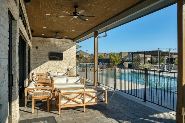 a view of a balcony dining table and chairs