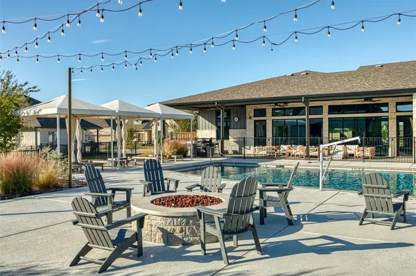 a view of a patio with a table and chairs