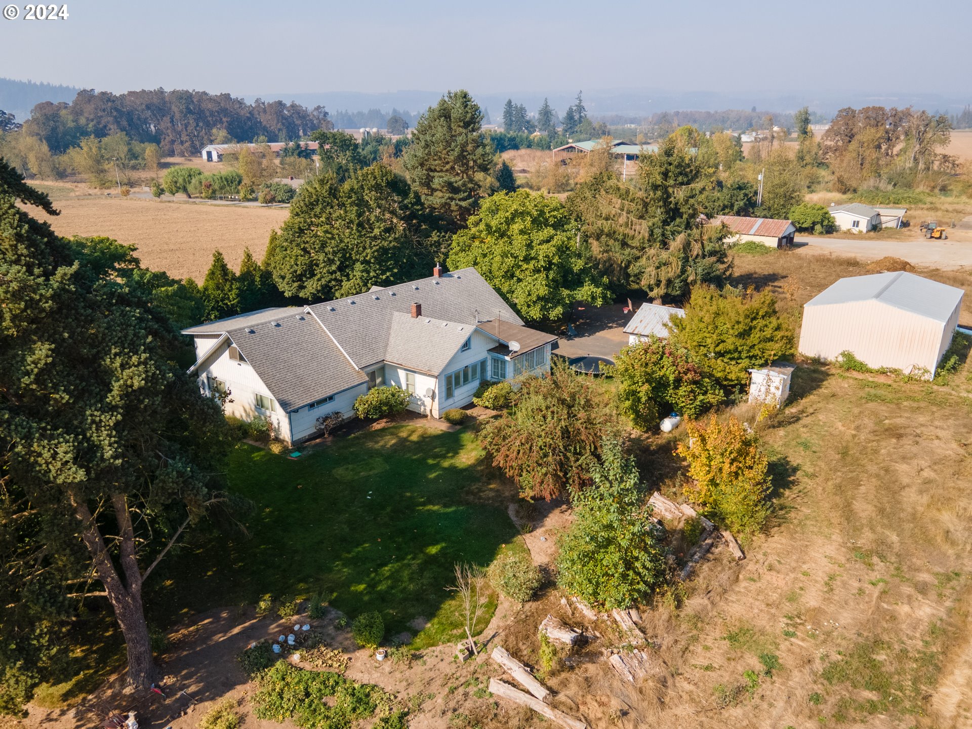 22892 Schultz Road Northeast Aurora, OR 97002 - Photo 39 of 42 a view of a lake with a building in the background