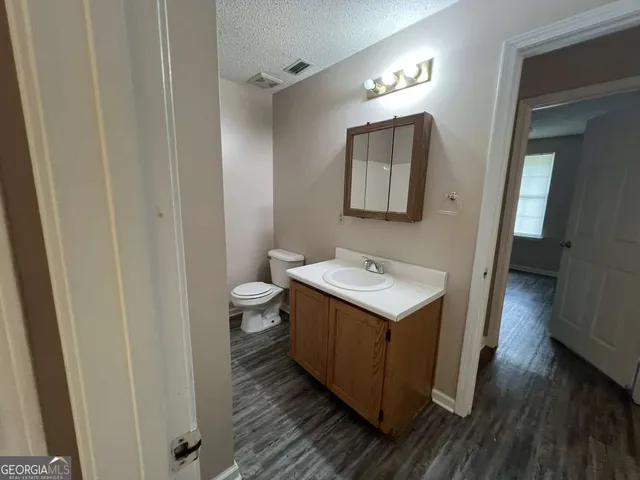 a bathroom with a sink and a toilet