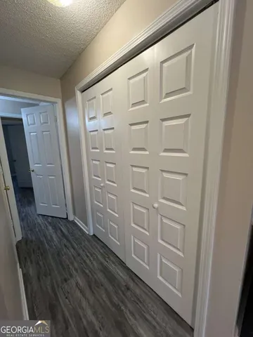 a utility room with cabinets washer and dryer