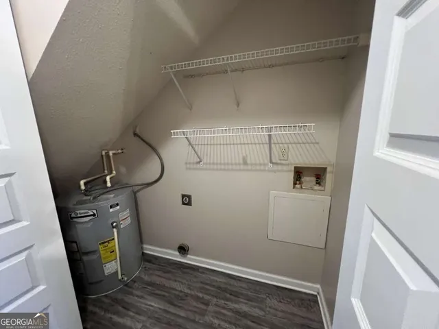 a bathroom with a sink toilet and mirror