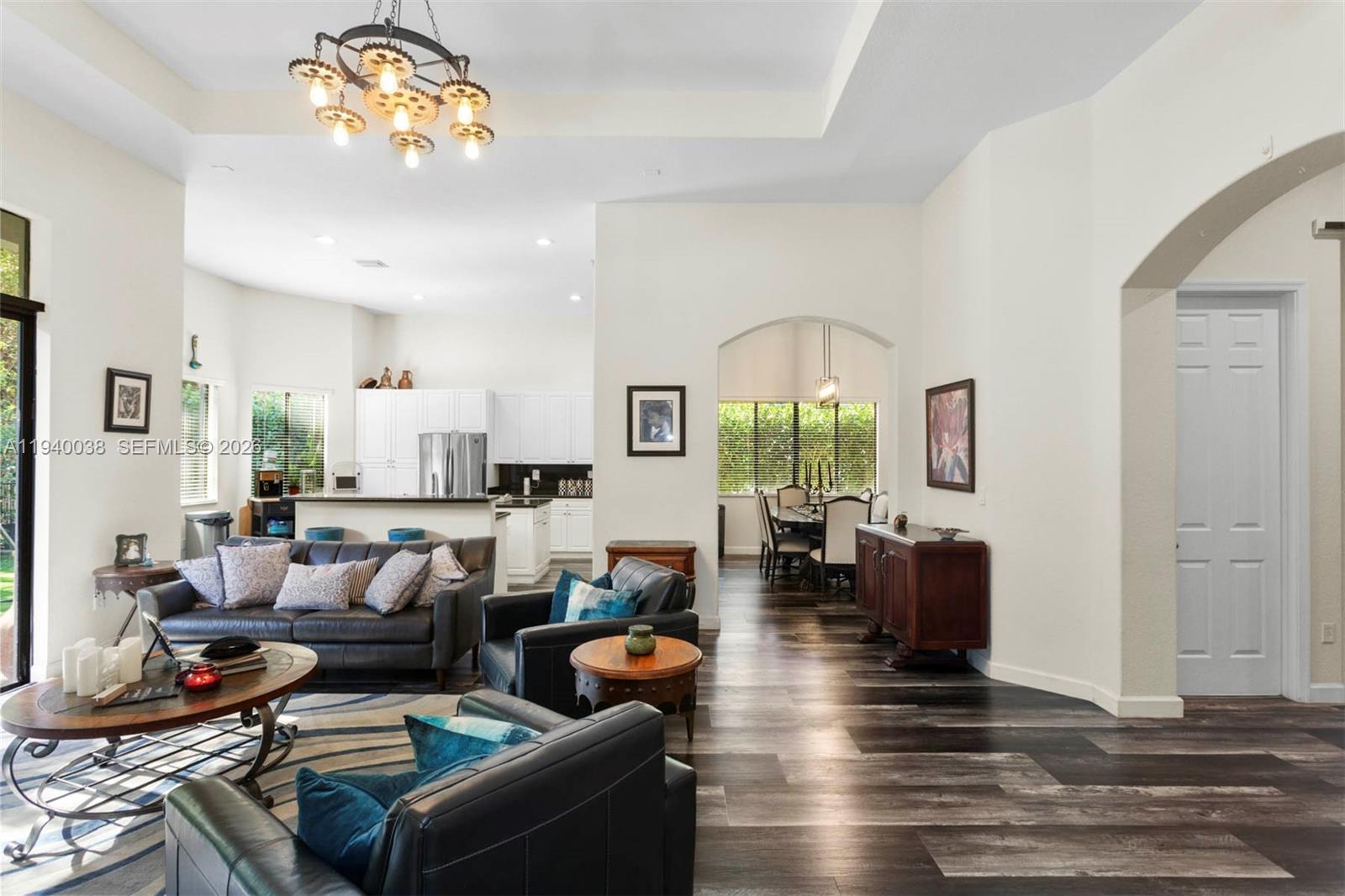 7666 Southwest 193rd Lane Cutler Bay, FL 33157 - Photo 14 of 45 a living room with fireplace furniture and a wooden floor
