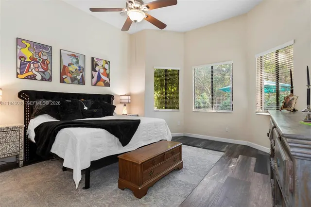 a bedroom with furniture and a window