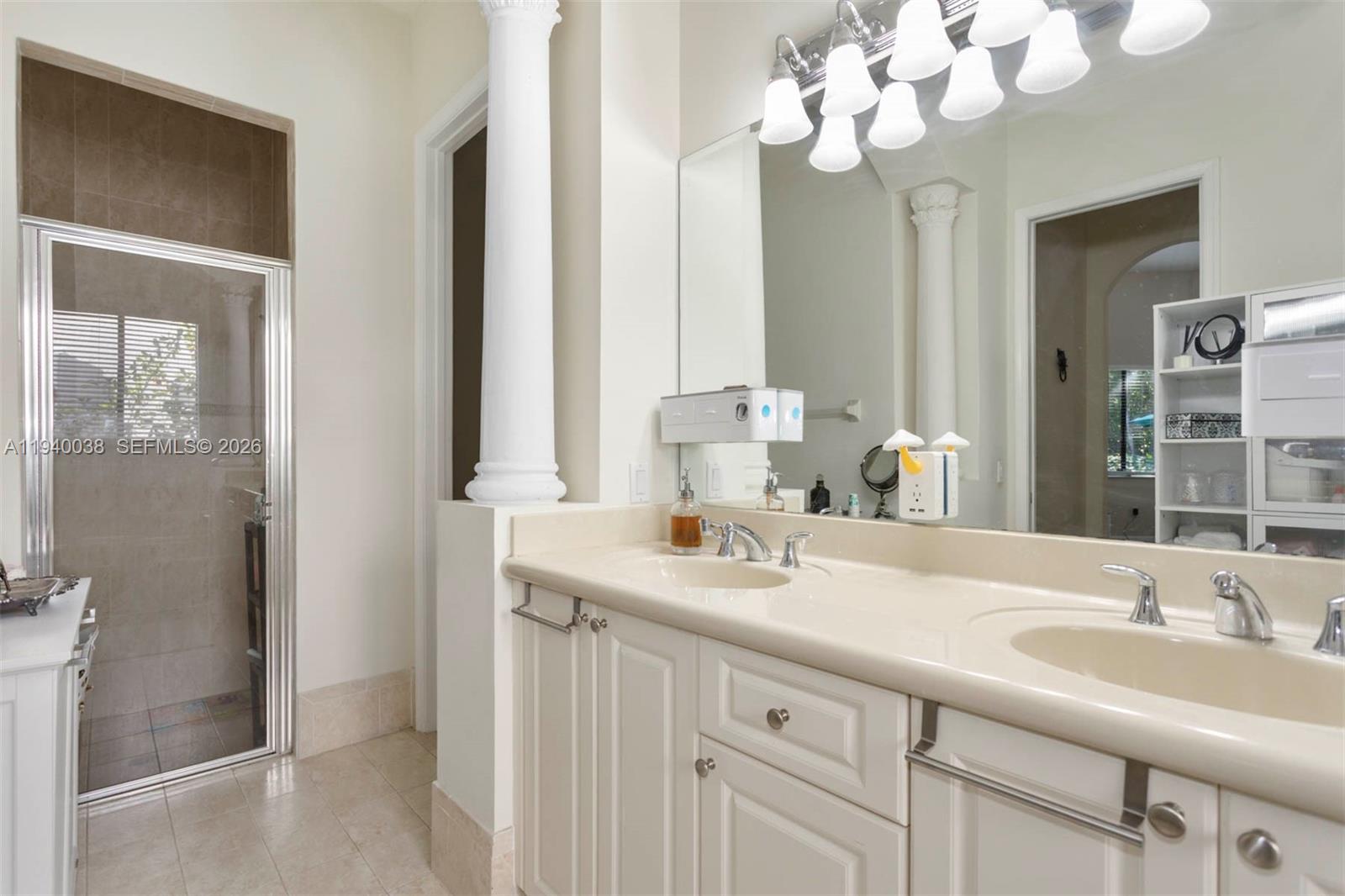 7666 Southwest 193rd Lane Cutler Bay, FL 33157 - Photo 24 of 45 a bathroom with a sink vanity granite and a mirror