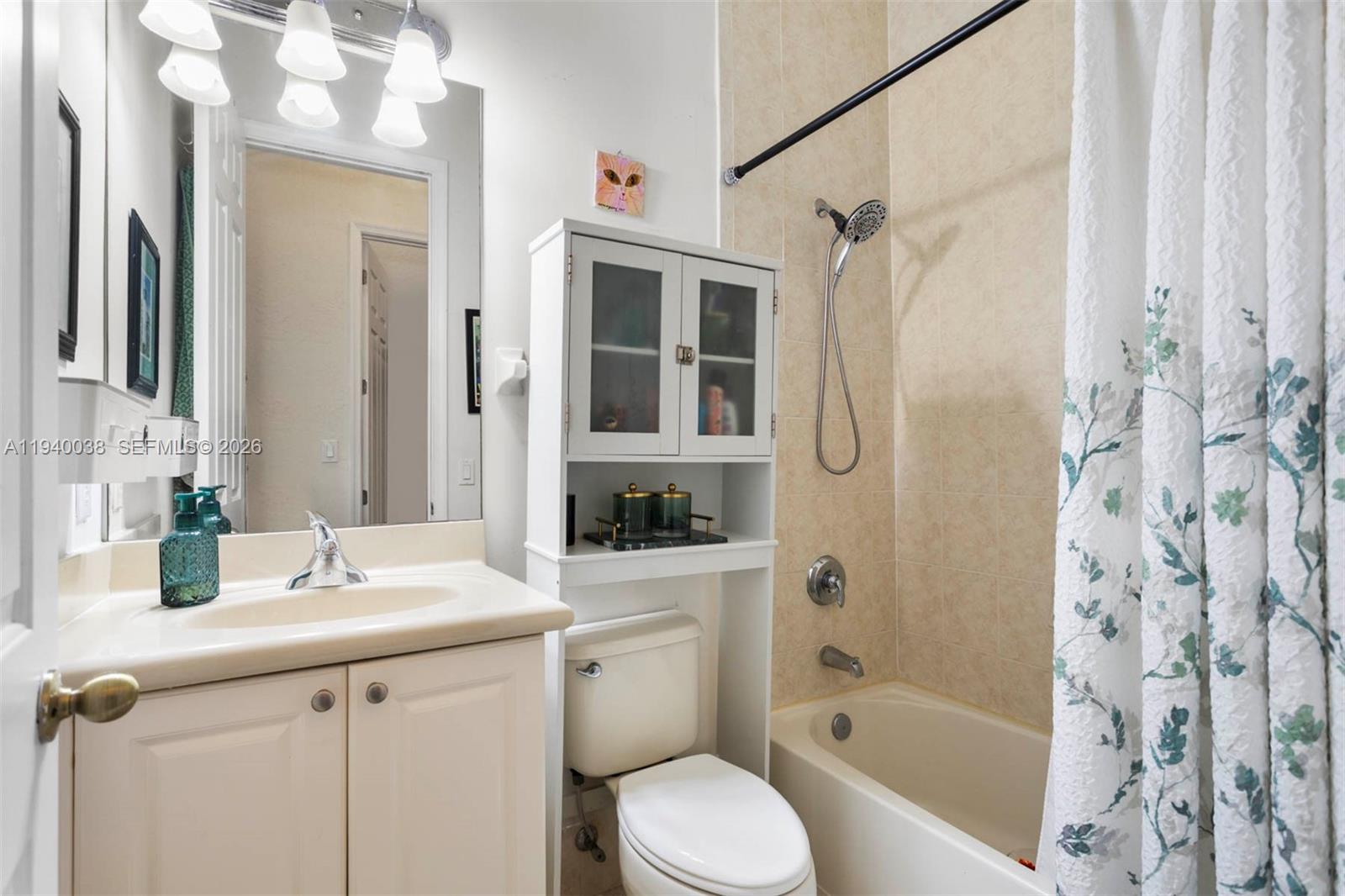 7666 Southwest 193rd Lane Cutler Bay, FL 33157 - Photo 28 of 45 a bathroom with a granite countertop sink toilet a shower and a mirror