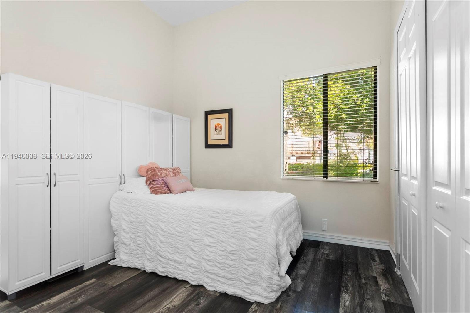 7666 Southwest 193rd Lane Cutler Bay, FL 33157 - Photo 29 of 45 a bedroom with a bed and a window