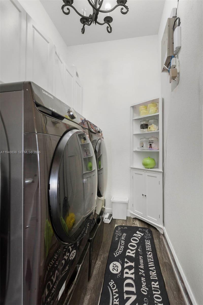 7666 Southwest 193rd Lane Cutler Bay, FL 33157 - Photo 31 of 45 a bedroom with a bed and a mirror