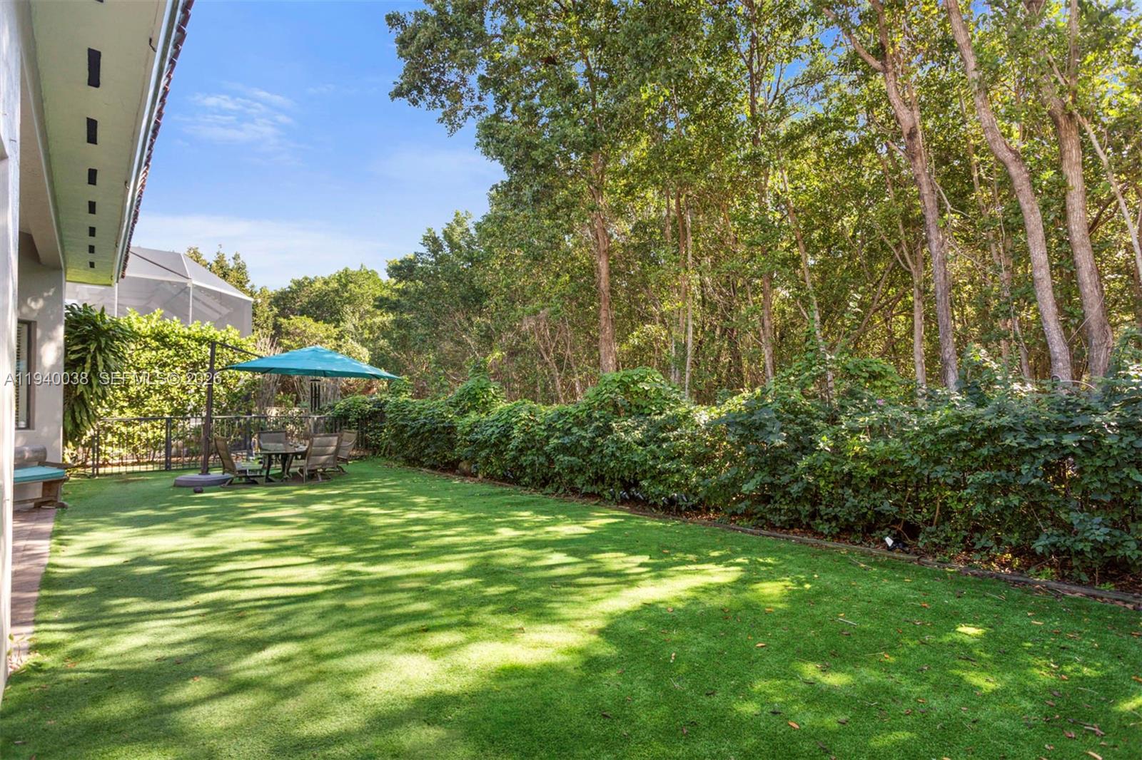 7666 Southwest 193rd Lane Cutler Bay, FL 33157 - Photo 32 of 45 a view of a big yard with plants and large trees