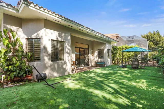 a view of a house with a yard porch and sitting area