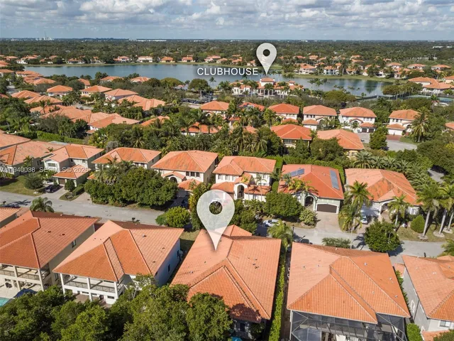 an aerial view of residential houses with outdoor space