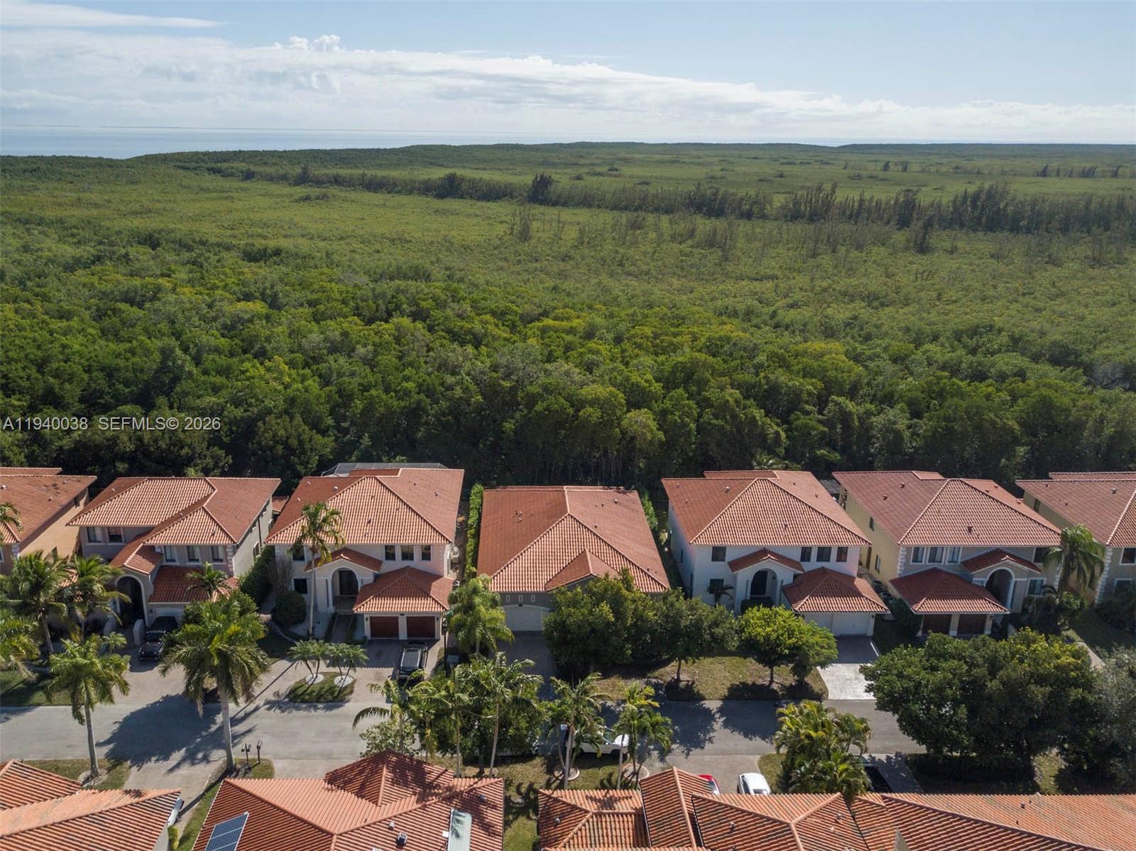 7666 Southwest 193rd Lane Cutler Bay, FL 33157 - Photo 40 of 45 an aerial view of residential houses with outdoor space and trees
