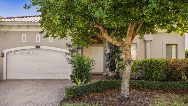 a view of a house with a tree