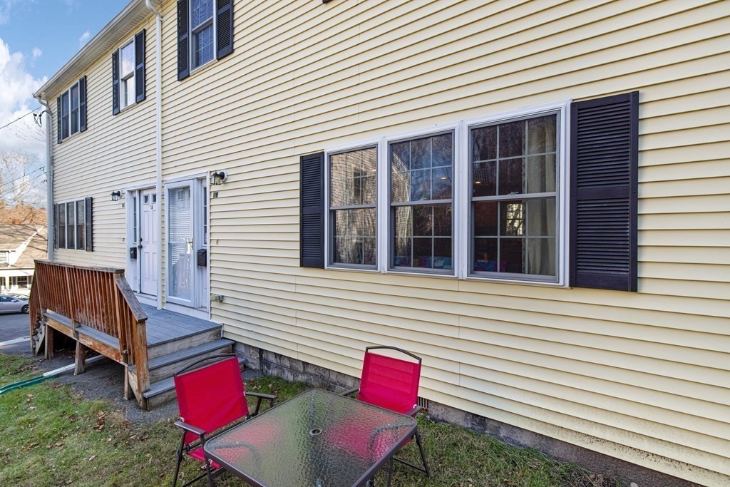 11 Spring Road, Unit B Arlington, MA 02476 - Photo 19 of 19 a view of a house with a chairs and a table