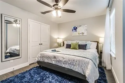 a bedroom with bed and window