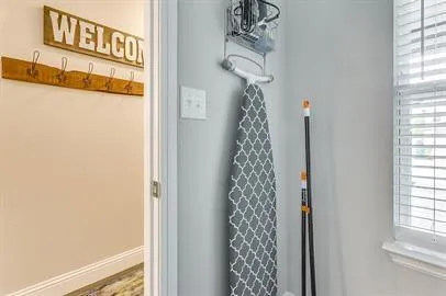 a bathroom with a shower curtain and window