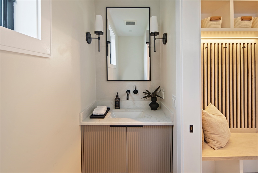 34 Pershing Road Needham, MA 02494 - Photo 19 of 41 a bathroom with a sink and a mirror