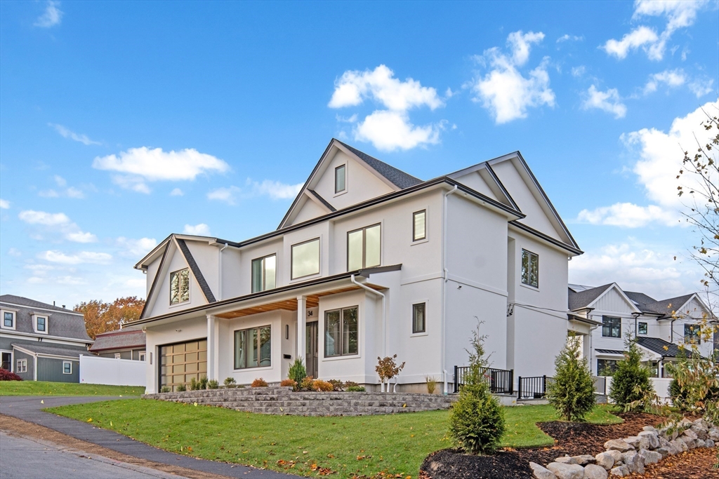 34 Pershing Road Needham, MA 02494 - Photo 2 of 41 a front view of a house with a yard