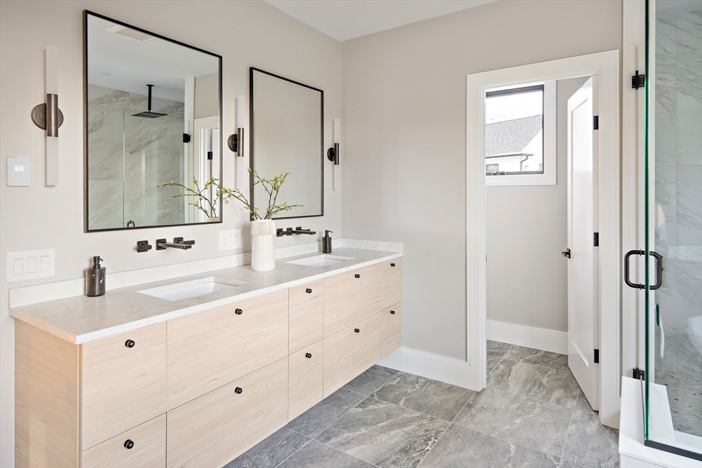 34 Pershing Road Needham, MA 02494 - Photo 28 of 41 a bathroom with a double vanity sink and mirror