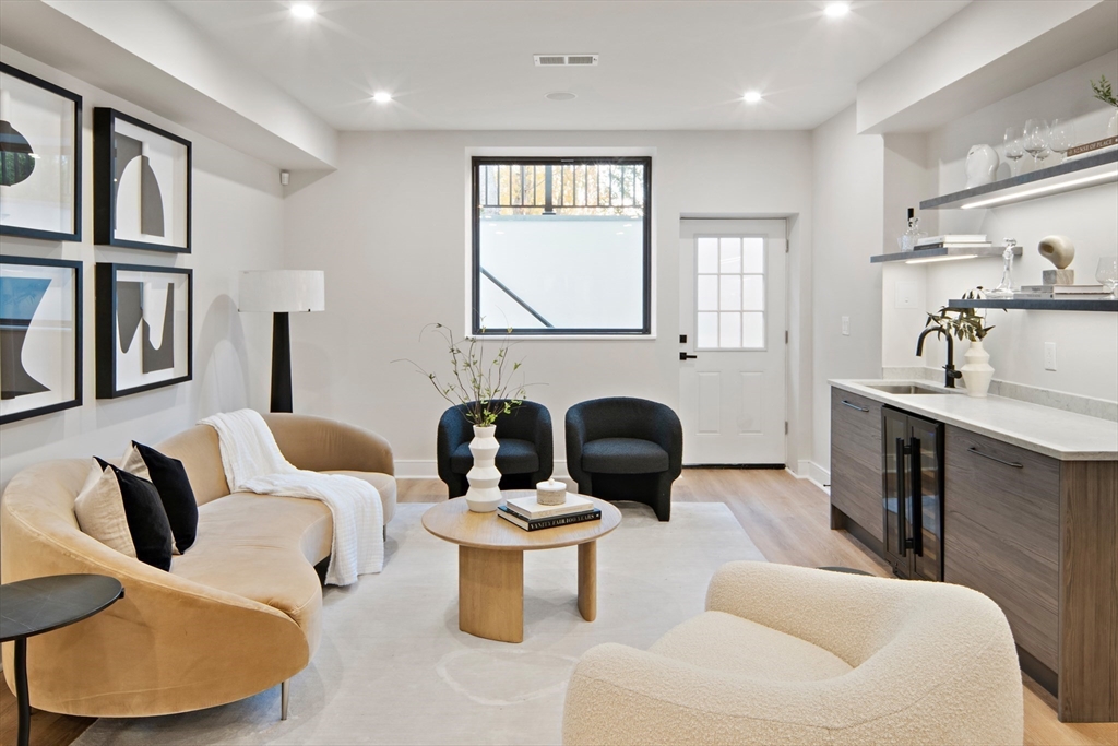 34 Pershing Road Needham, MA 02494 - Photo 29 of 41 a living room with furniture or window and a lamp