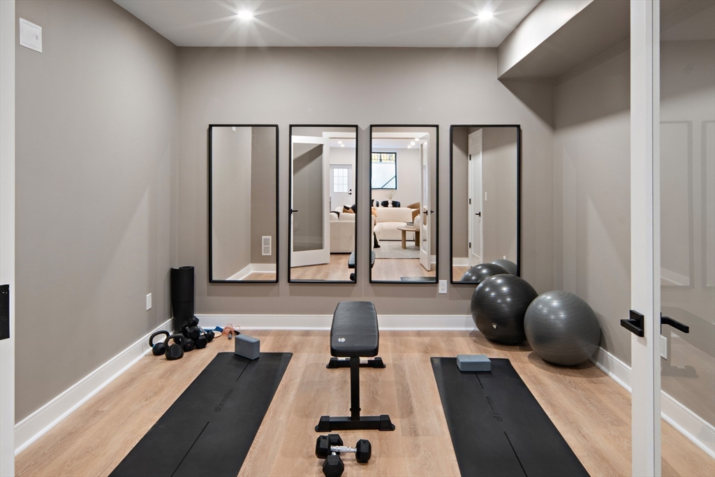 34 Pershing Road Needham, MA 02494 - Photo 31 of 41 a view of a balcony with a couch and chairs