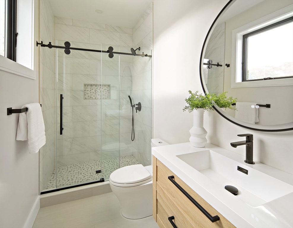 34 Pershing Road Needham, MA 02494 - Photo 34 of 41 a bathroom with a sink toilet and shower