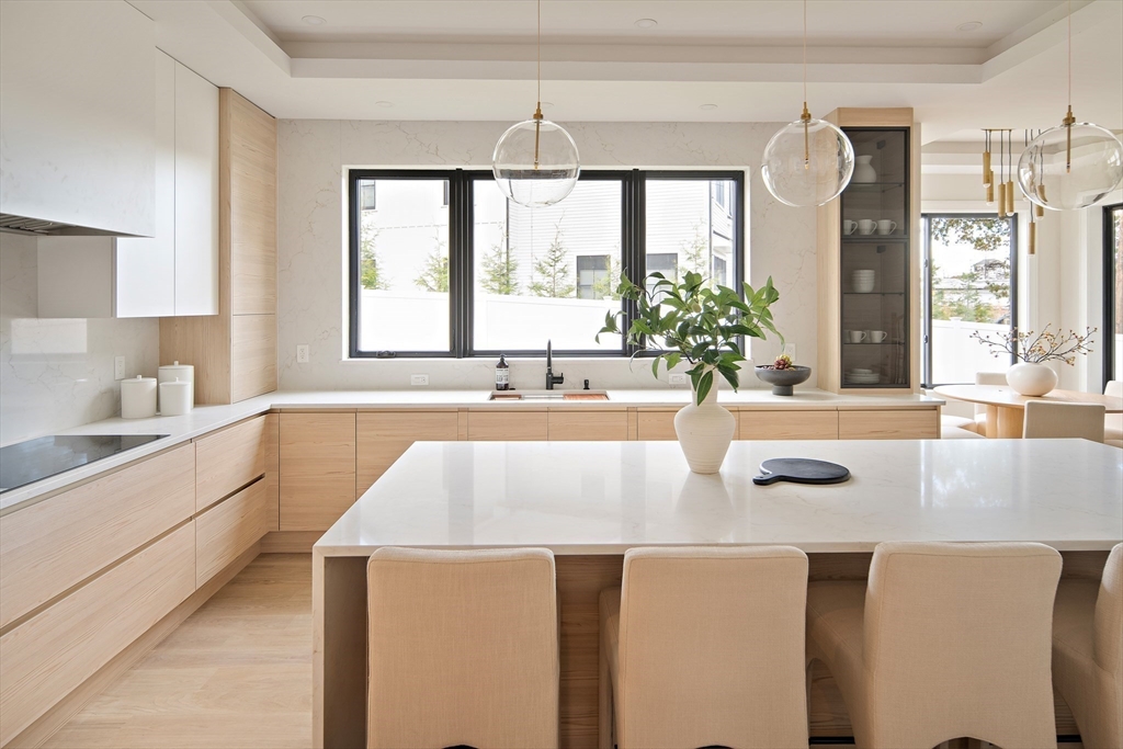 34 Pershing Road Needham, MA 02494 - Photo 8 of 41 a large kitchen with kitchen island granite countertop a large window