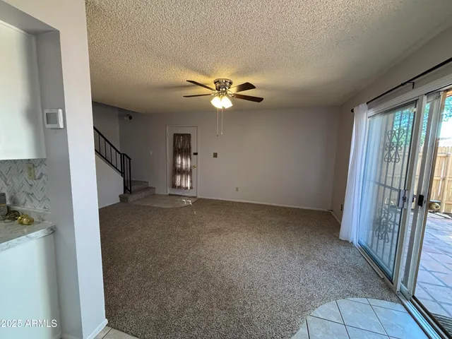 a view of an empty room with a fireplace