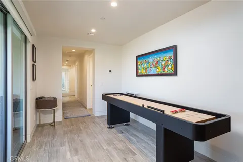 a view of room with furniture and wooden floor