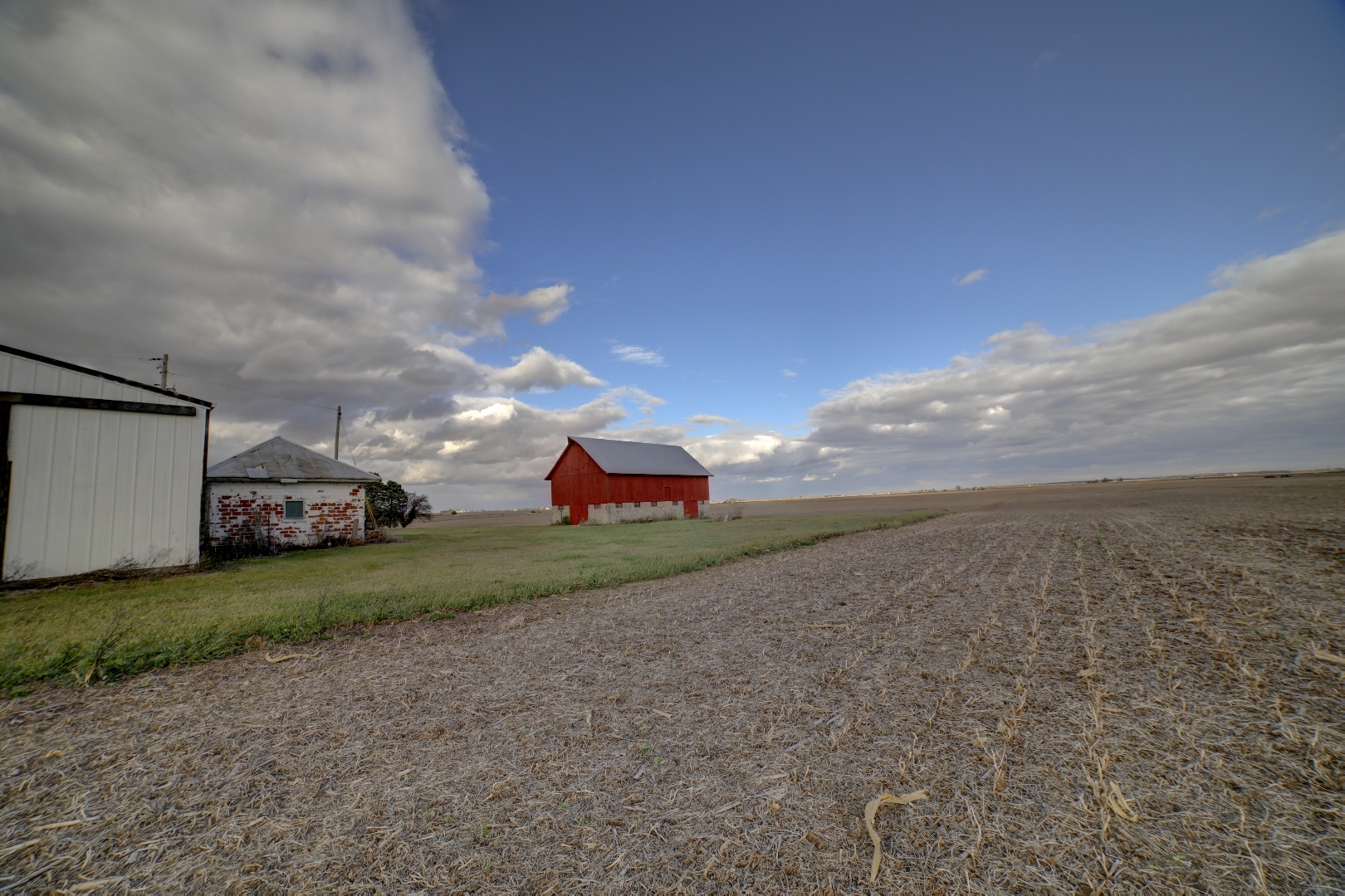 2018 Highway 45 Gilman, IL 60938 - Photo 12 of 16 a view of a big yard with an house and wooden fence