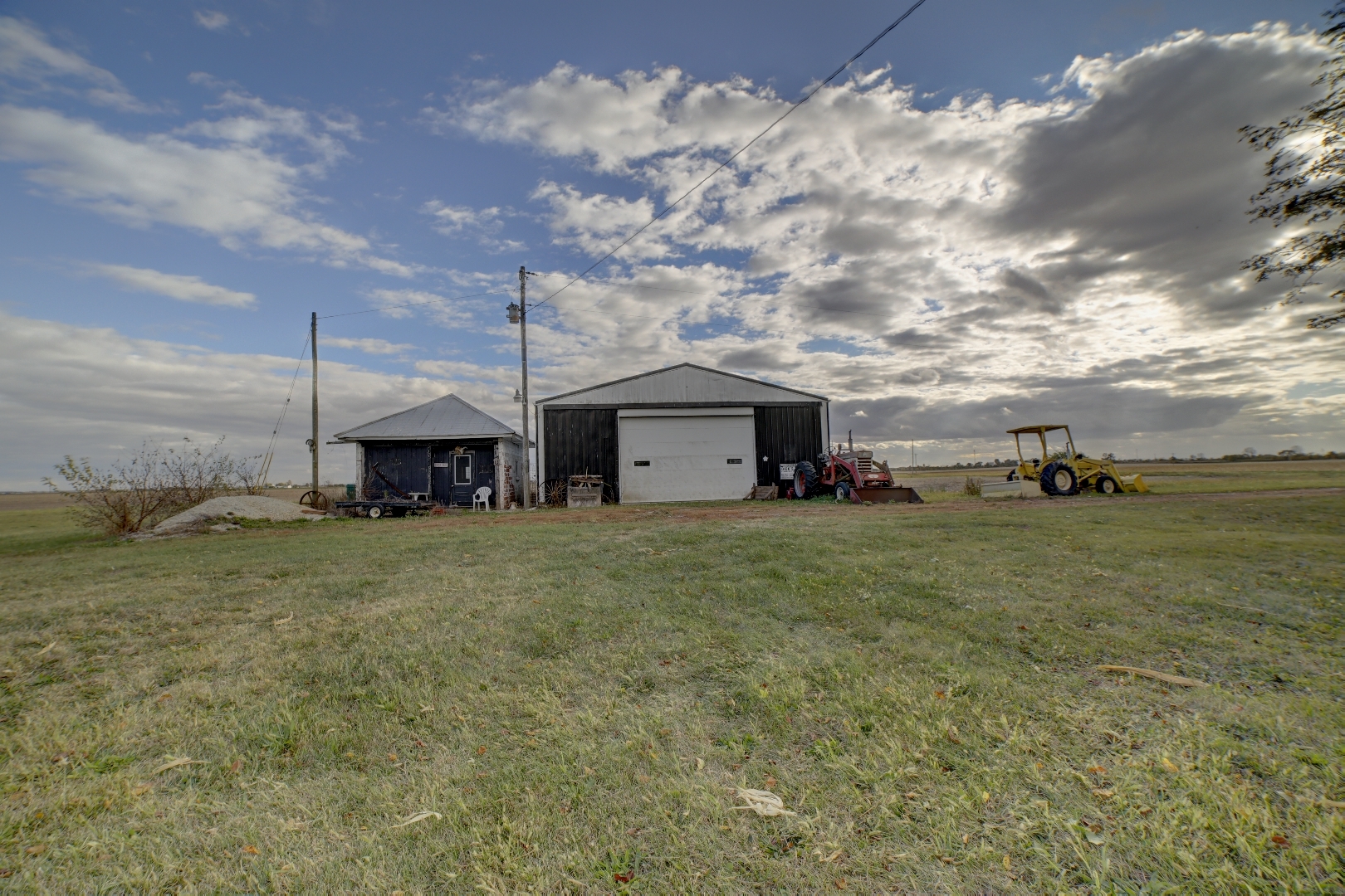2018 Highway 45 Gilman, IL 60938 - Photo 15 of 16 a view of a big house with a big yard and large tree