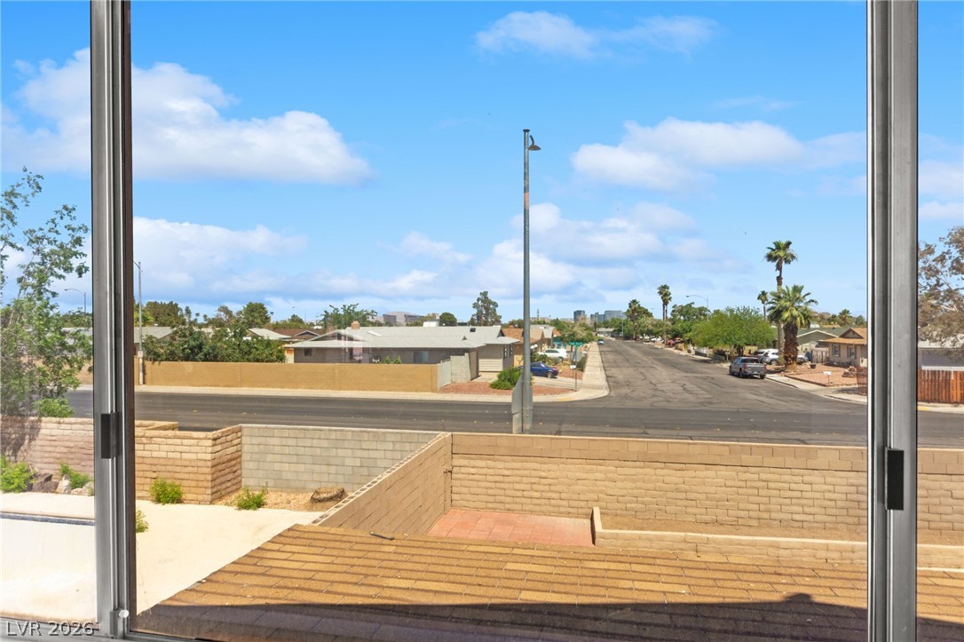 4430 Cranbrook Way Las Vegas, NV 89103 - Photo 37 of 50 Overlooking a tranquil neighborhood, this view captures mature landscaping and open skies.