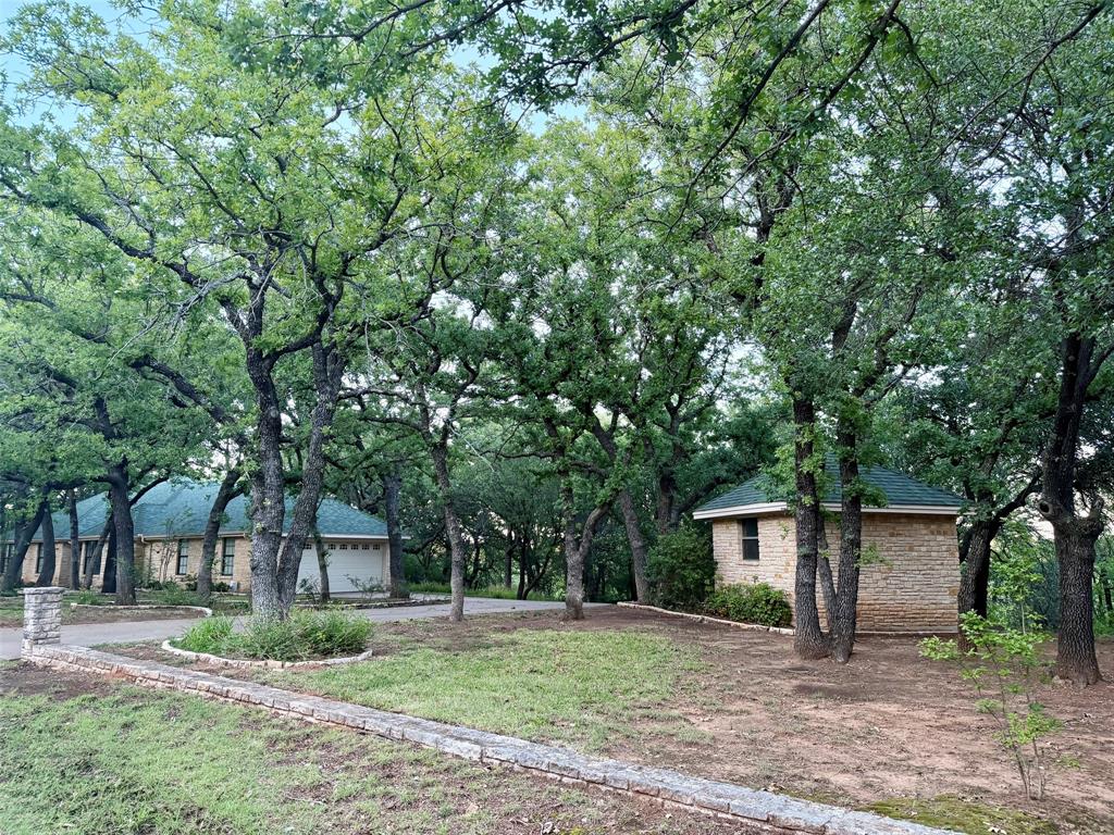 150 Timberidge Lake Road Graham, TX 76450 - Photo 5 of 25 a front view of a house with garden