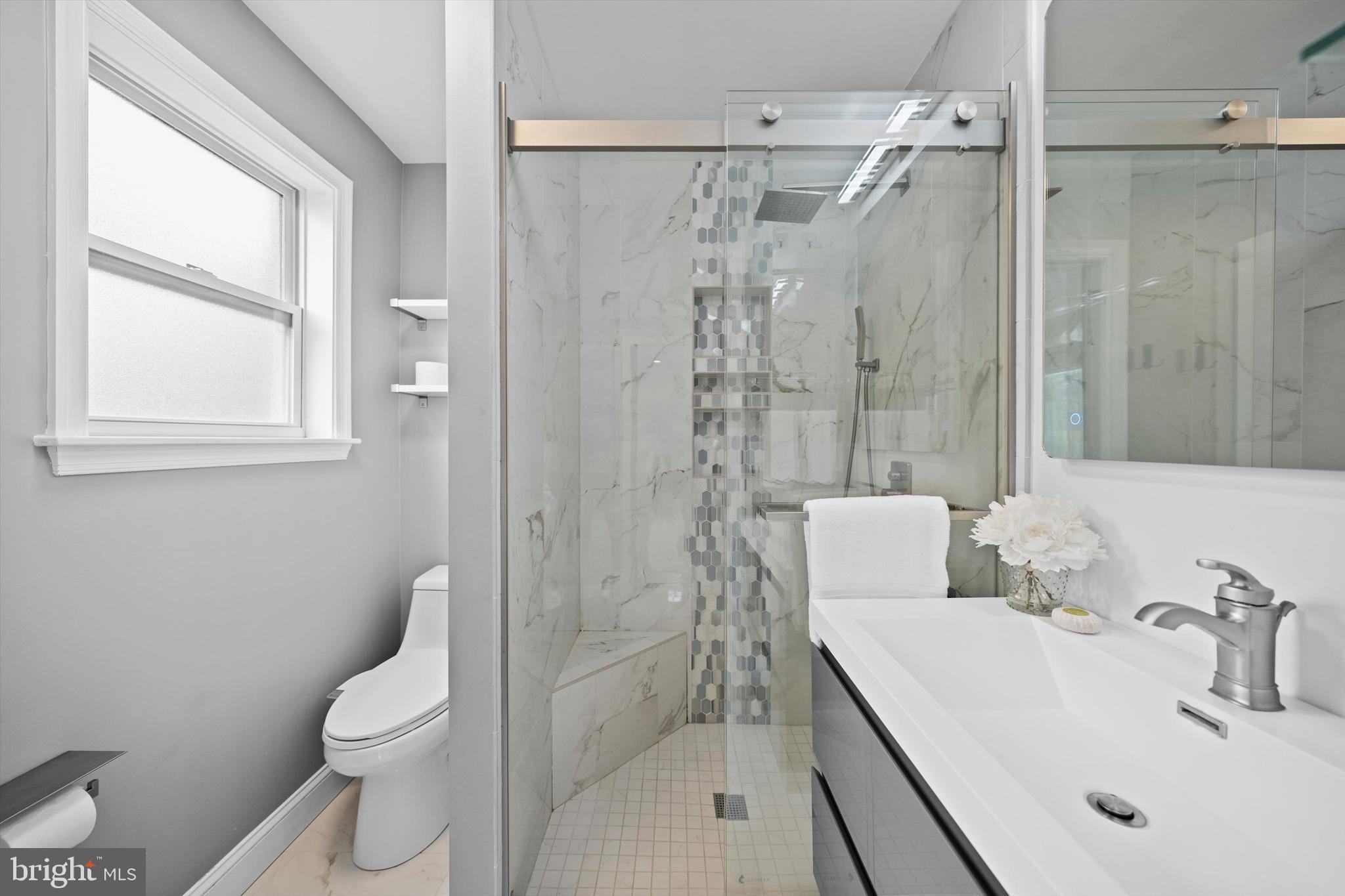 3206 North Glebe Road Arlington, VA 22207 - Photo 11 of 20 a bathroom with a sink toilet and shower