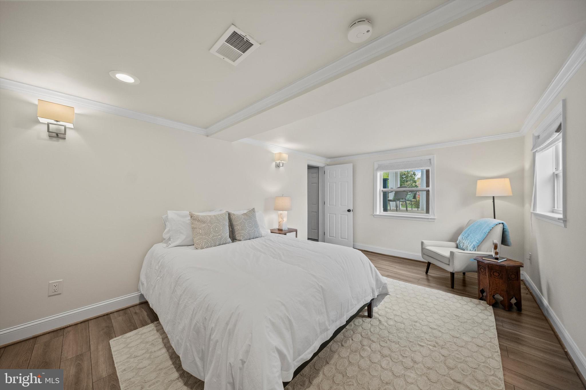 3206 North Glebe Road Arlington, VA 22207 - Photo 14 of 20 a bedroom with a bed and wooden floor