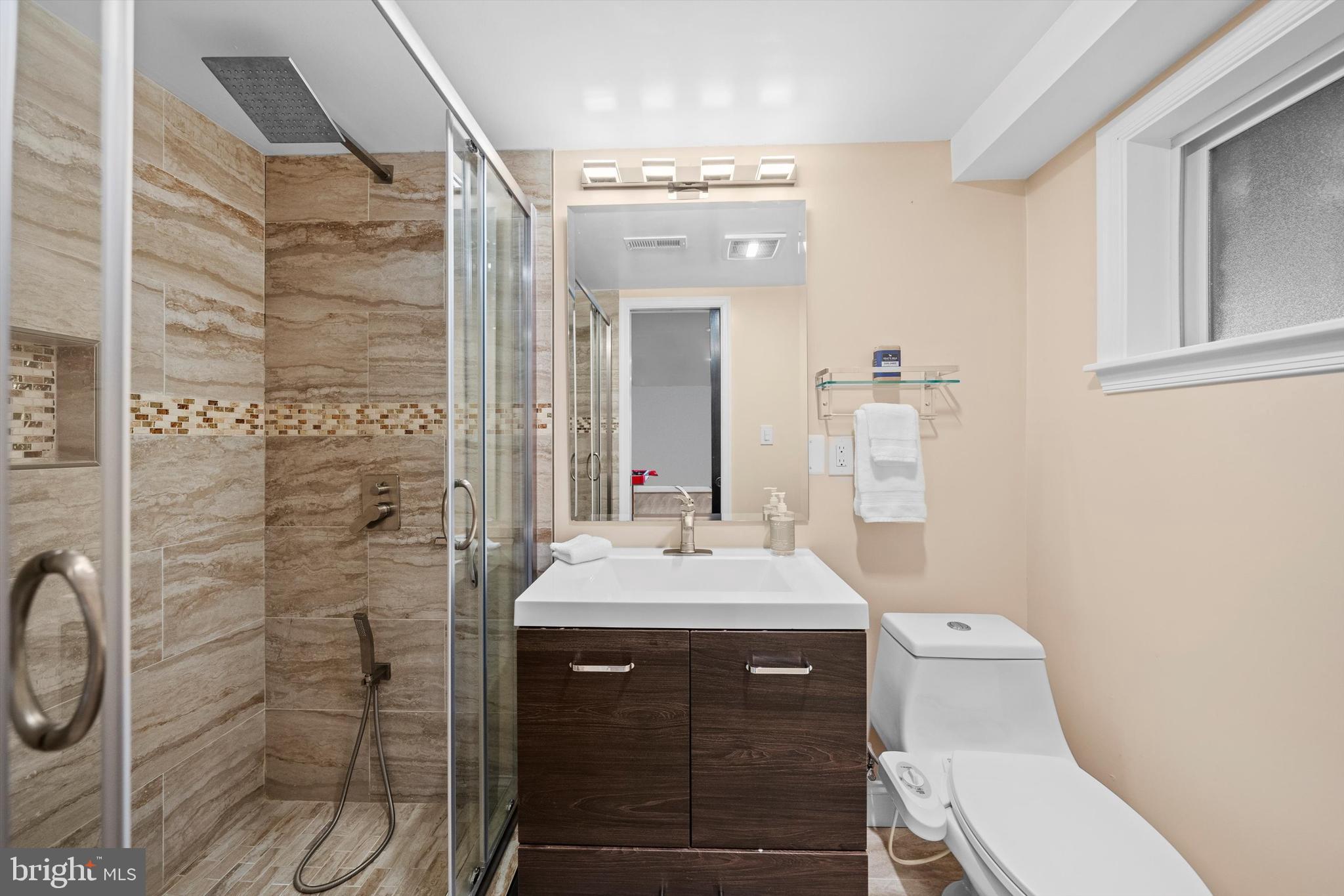 3206 North Glebe Road Arlington, VA 22207 - Photo 17 of 20 a bathroom with a sink a toilet and shower