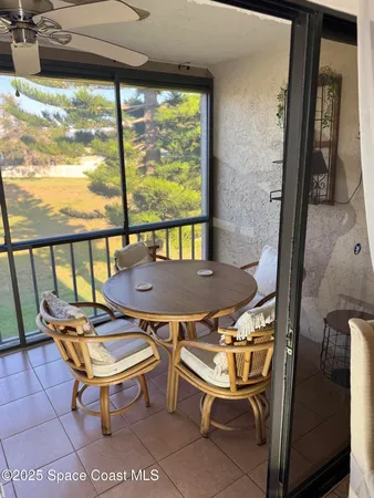 a balcony with couch and city view