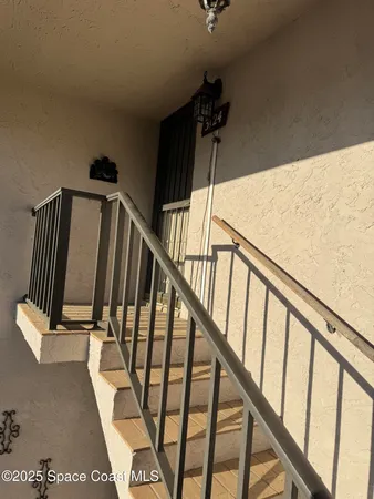 a bathroom with a sink a toilet and shower curtain