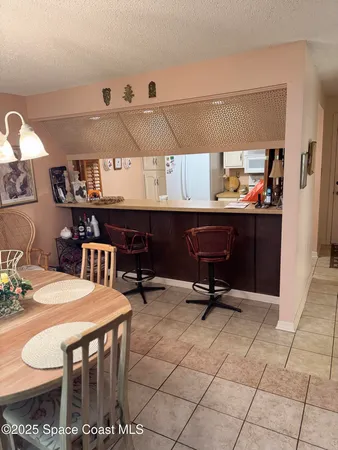 a room with a couch and a bookshelf