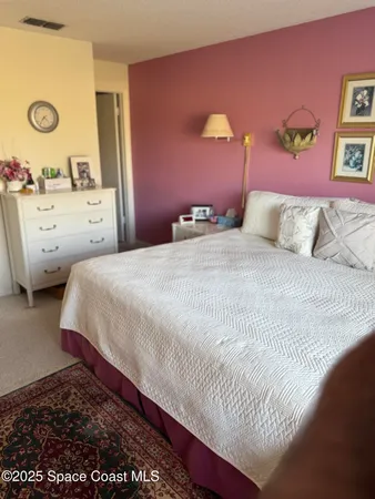 a room with a bed and large window