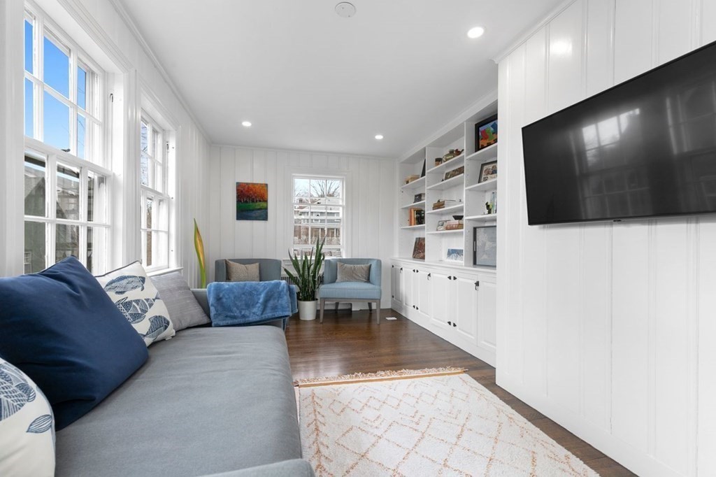 10 Standish Road Milton, MA 02186 - Photo 12 of 28 a living room with furniture and a flat screen tv