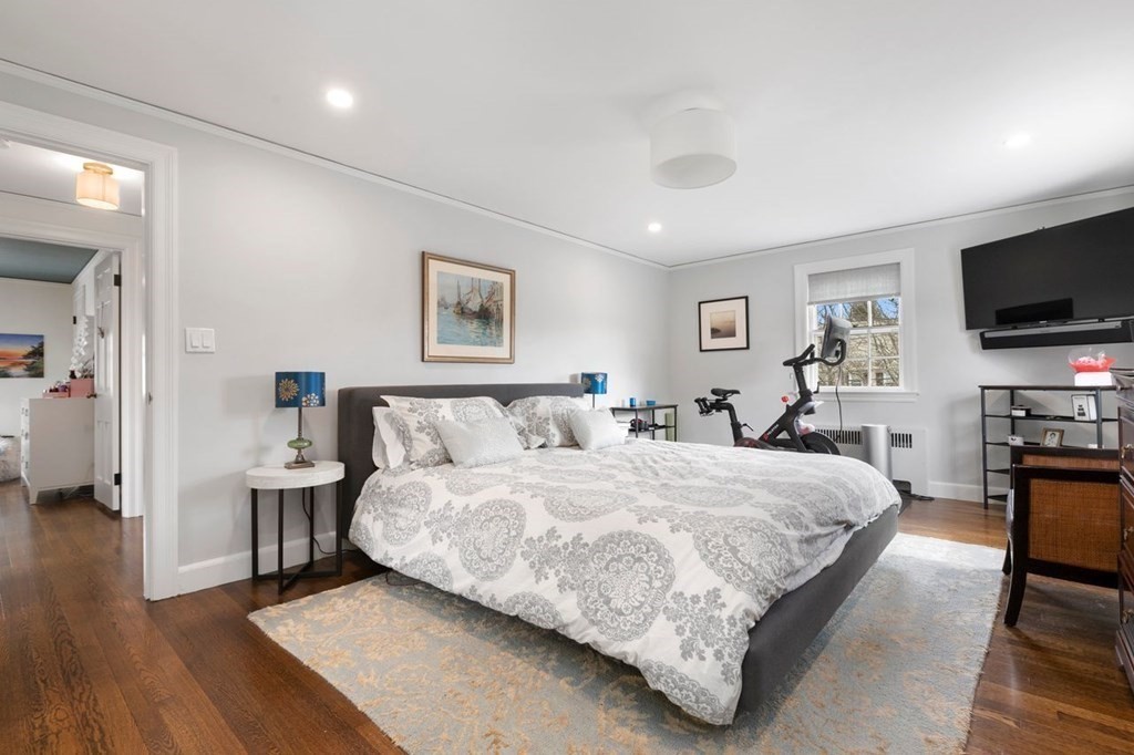 10 Standish Road Milton, MA 02186 - Photo 15 of 28 a bedroom with a bed and a flat screen tv